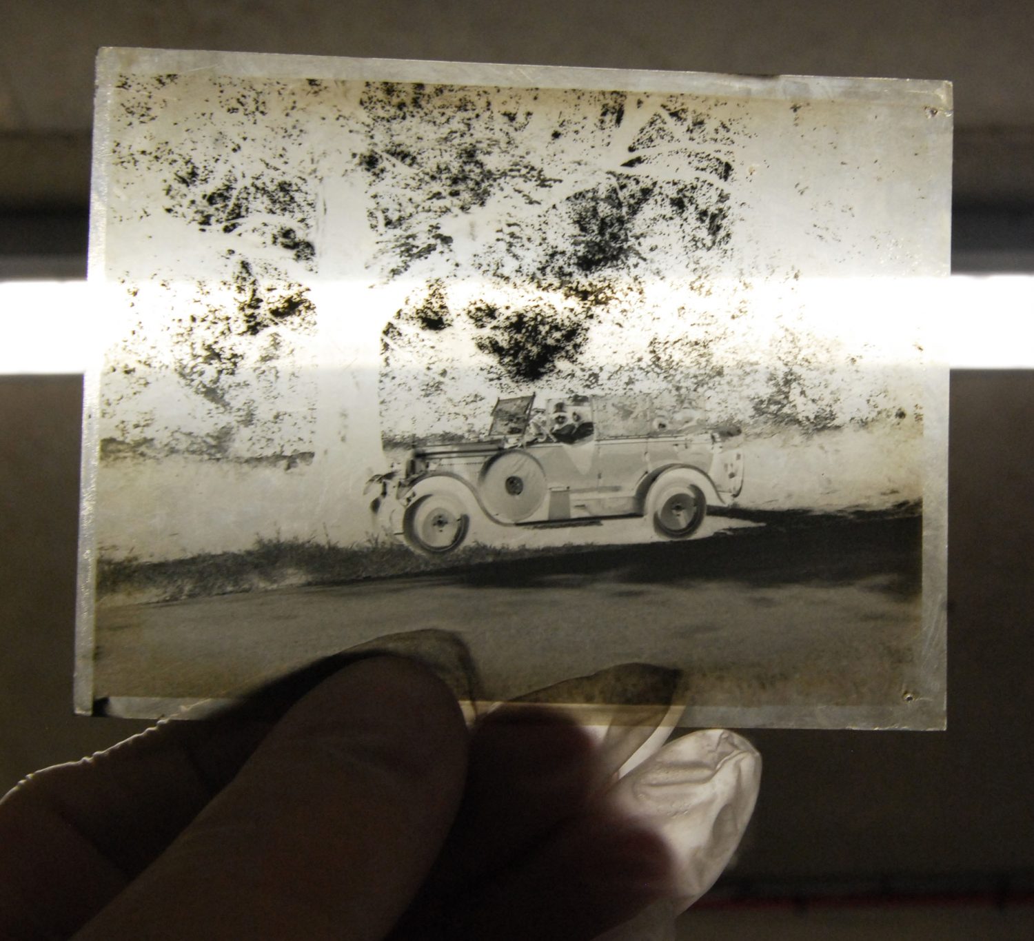 Glass photographic negative of a car