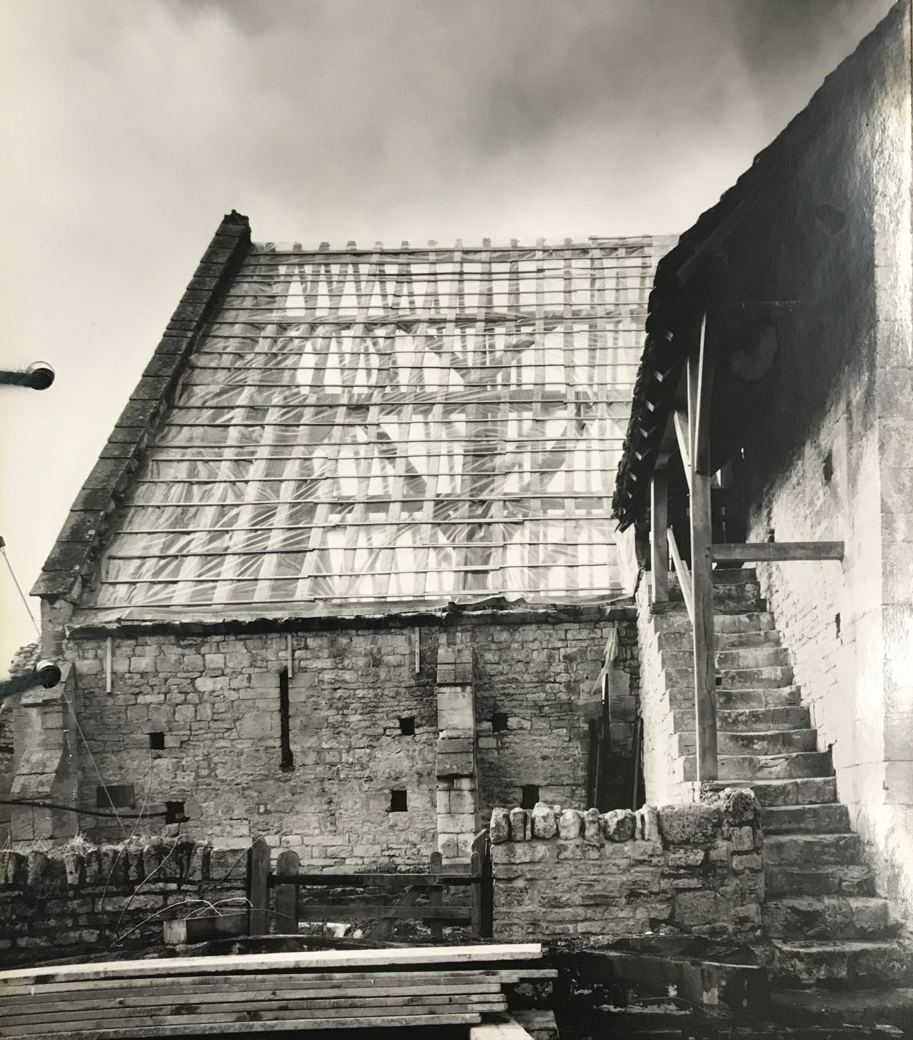 View of Bredon Barn roof from the outside, temporarily covered while undergoing reconstruction