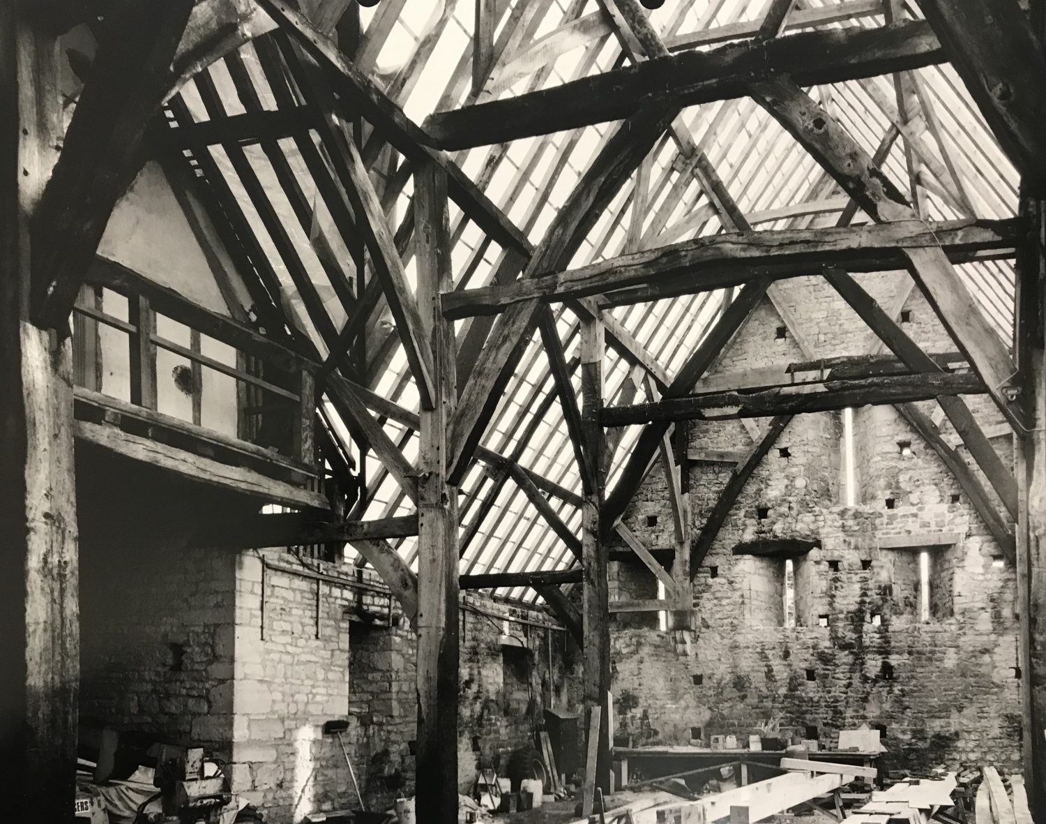 Bredon Barn, part way through its reconstruction. Note the charred roof timbers and scarfed-in repairs