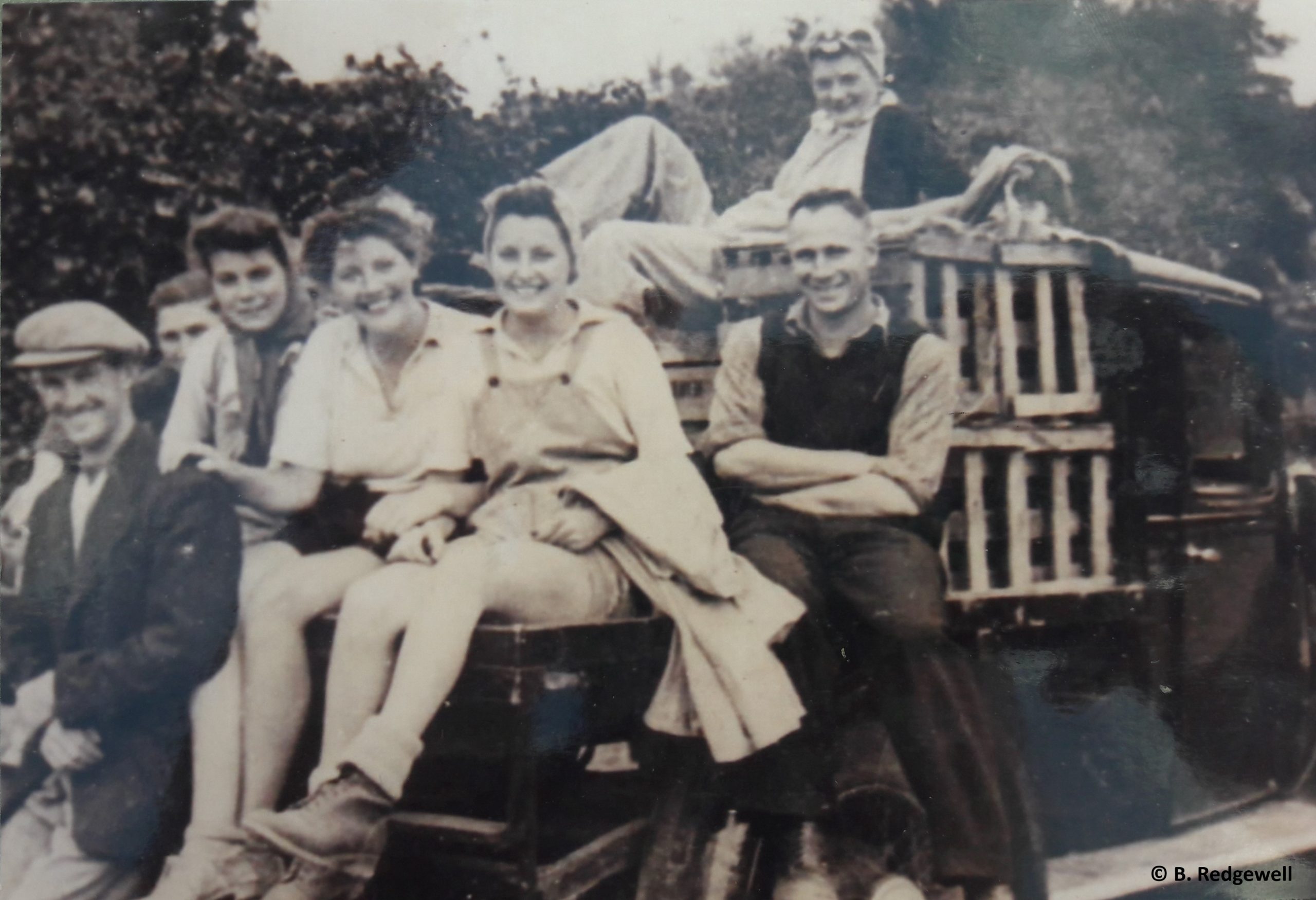 Land girls and employers by truck