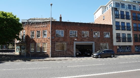 This purpose-built funeral parlour, in Worcester, was completed in 1938, to a design by Henry Rowe. Still in use as funeral directors today the building makes a strong contribution to the street scene.