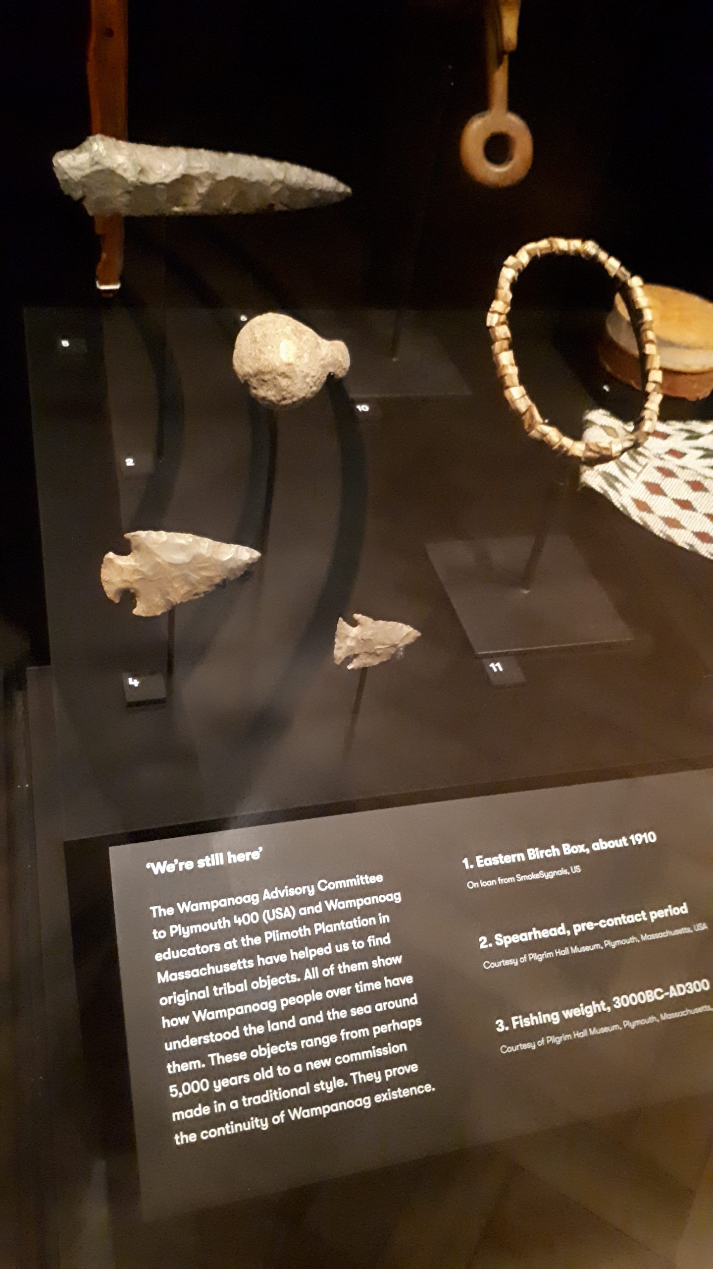 Examples of original Wampanoag tribal objects, some of which are as much as 5000 years old on display at Mayflower 400 at The Box, Plymouth. These included a fishing weight, spearhead, beaded sash and burden basket.