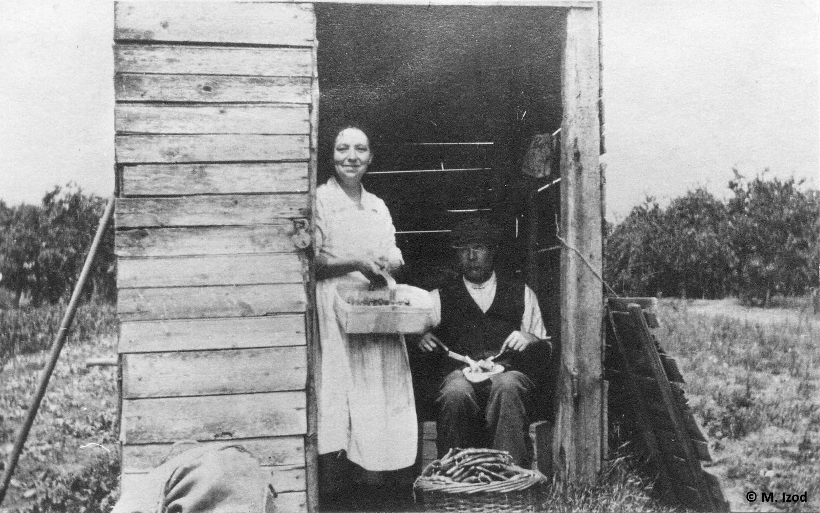 Couple in small wooden hovel