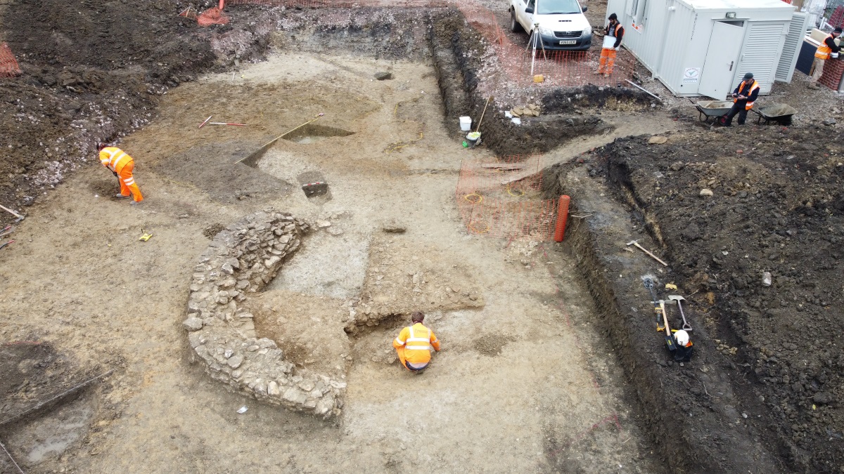 Excavation of semi-circular stone walls of Calne lime kiln