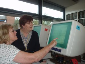 Picture of somebody using a microfilm reader