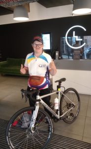 Picture of Louisa on a cycling challenge for the National Autistic Society