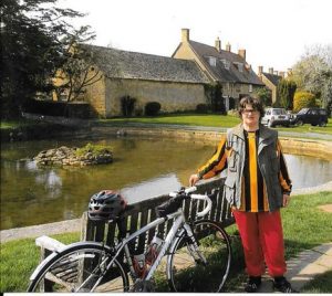 Louisa with her bike outside