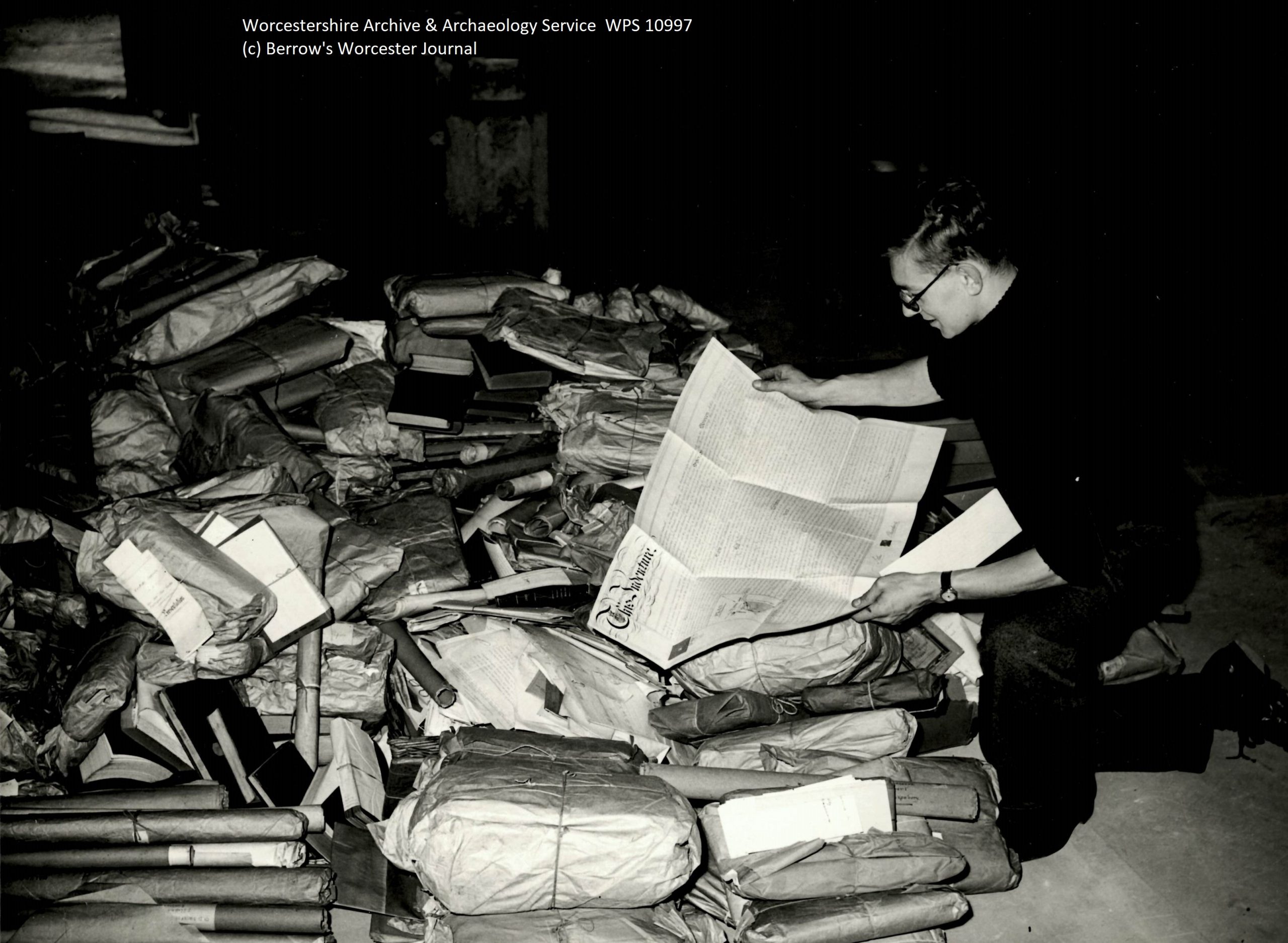 Brian Smith searching through a large pile of packages