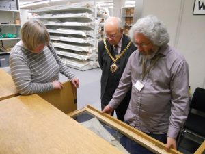 Adrian showing the contents of a display shelf