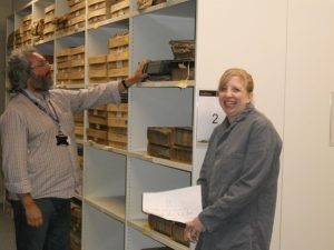 Adrian looking at an archive shelf