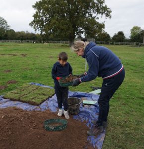 Sieving through soil for finds