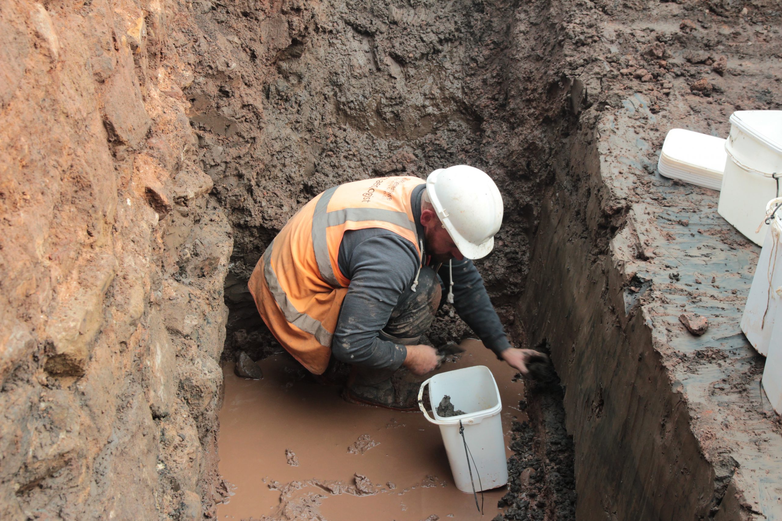 Archaeologist taking soil sample