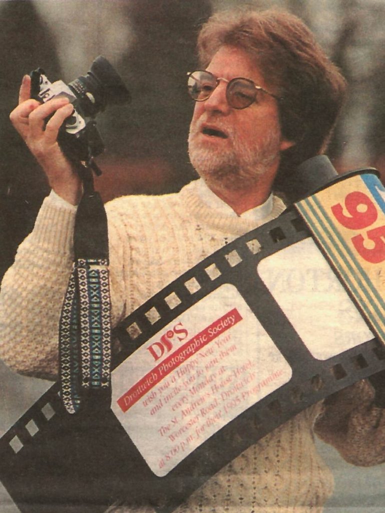 Publicity secretary Gordon Pritchard with a film cartridge made by member Peter Preece, photo taken by Mike Carter, The Droitwich Advertiser, 12th Jan 1994. © Newsquest. 705:1449 BA14368/1/35 