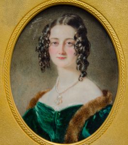 Colour painting in gold circular frame of Cassandra Jane Knight