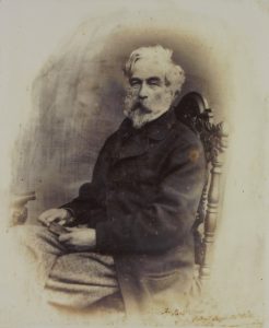 Image of a man sat on a chair 