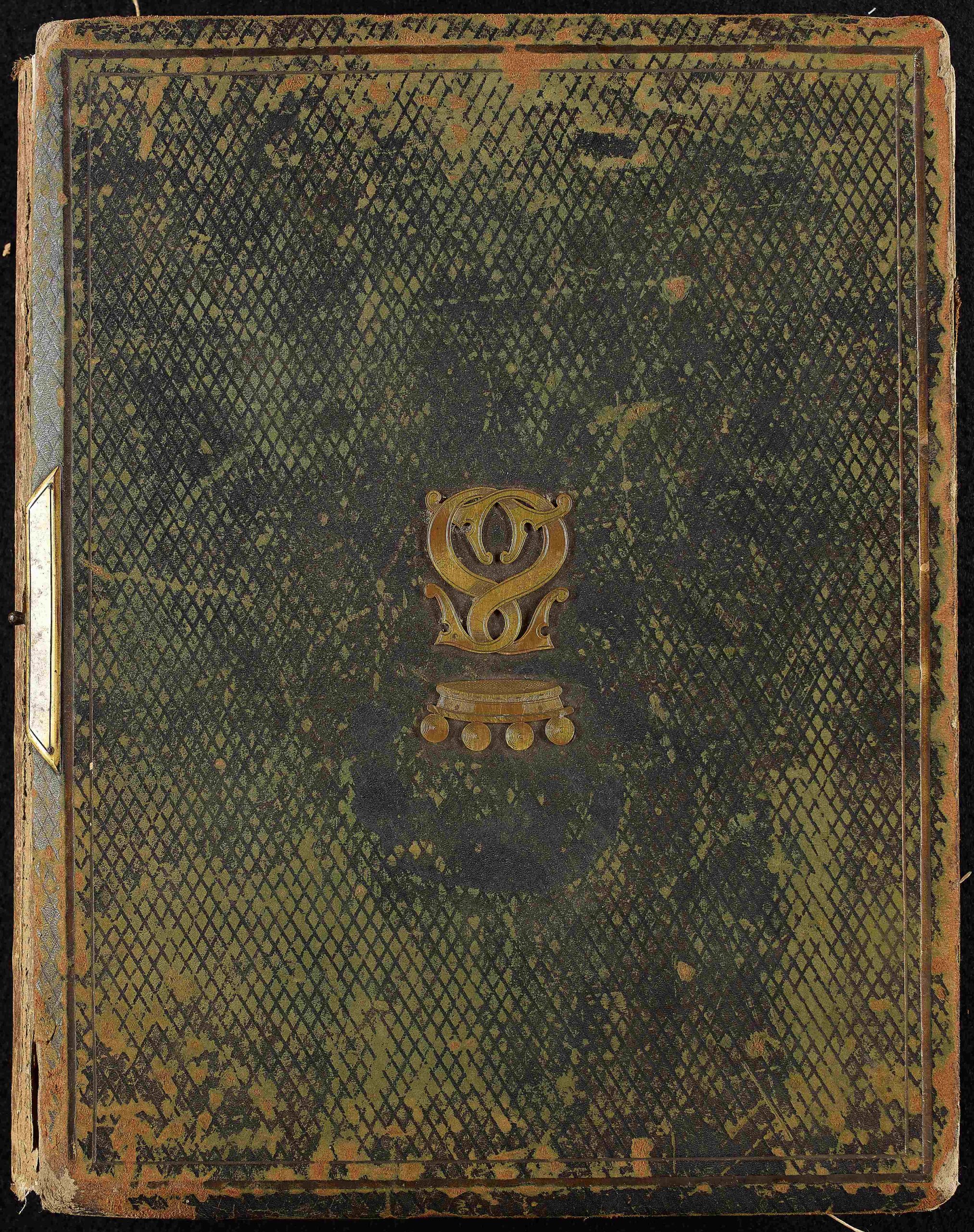 Heavy green front cover of photo album with two gold s letters intertwined