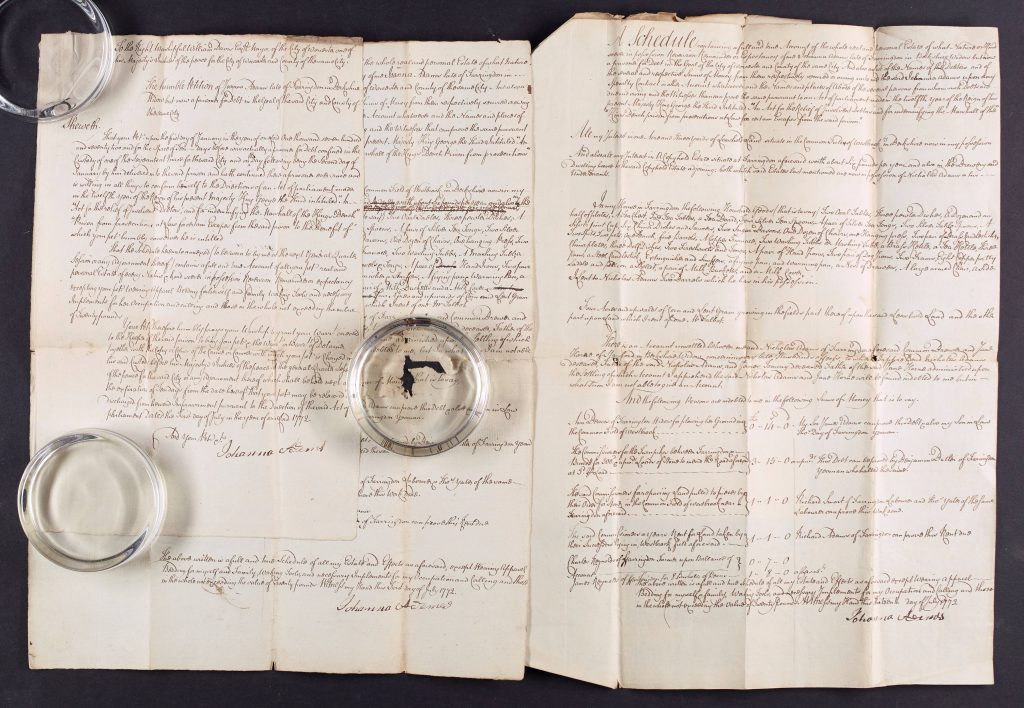 Petition, oath and schedule of goods for Insolvent Debtor Johanna Adams. Insolvent Debtors could be imprisoned for debt, and their schedule listed their lands and property (excluding wearing apparel, bedding and working tools and include debts owed to the debtor). They could, as in the case of Adams to the Mayor of Worcester, petition for their release under the Acts for the Relief of Insolvent Debtors. c1769 Finding No: 496.5 BA9360/A8/Box 2a/12/1-2