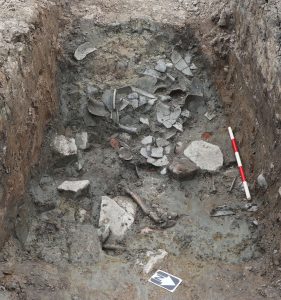 Ditch filled with broken pottery
