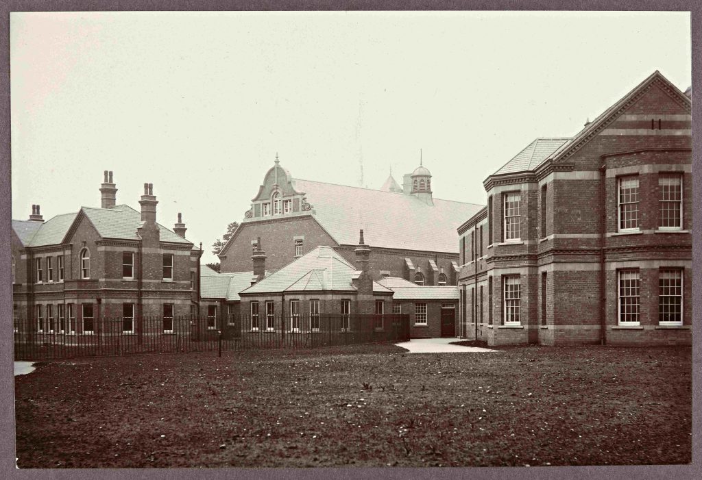 Black and white photograph of brick buildings which form part of Barnsley Hall Asylum dated 1907