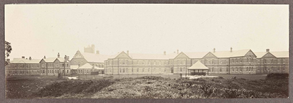 Black and white photograph of brick buildings which form part of Barnsley Hall Asylum dated 1907