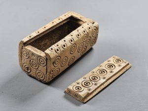 Carved bone box with sliding lid