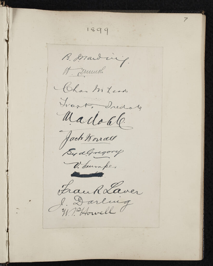 Handwritten signatures, black ink on paper. 11 signatures and a crossed-out word one above the other.