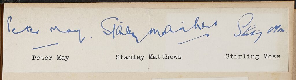 Three signatures, blue ink on paper. Left to right: Peter May; Stanley Matthews: Stirling Moss